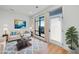 Bright living room showcasing hardwood floors, natural light, and comfortable seating at 615 Daniels St # 316, Raleigh, NC 27605