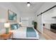 Inviting bedroom with bright decor, closet, and access to kitchen area at 615 Daniels St # 316, Raleigh, NC 27605