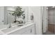 Double vanity bathroom with access to walk in closet and shower at 64 Tributary Way, Fuquay Varina, NC 27526