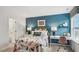 Bedroom with floral comforter, teal walls, and workspace at 64 Tributary Way, Fuquay Varina, NC 27526