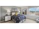 Cozy bedroom with a space-themed comforter and large window at 64 Tributary Way, Fuquay Varina, NC 27526