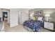 Bedroom with a space-themed comforter and view of backyard at 64 Tributary Way, Fuquay Varina, NC 27526