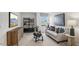 Cozy lounge area featuring a sofa and built-in shelving at 64 Tributary Way, Fuquay Varina, NC 27526