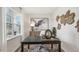 Home office features a desk, window, and decorative wall art at 64 Tributary Way, Fuquay Varina, NC 27526