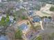 Scenic aerial view of newly constructed home with surrounding golf course and lush greenery at 6805 Greystone Dr, Raleigh, NC 27615