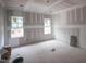 Unfinished bedroom featuring 2 windows with natural light at 6805 Greystone Dr, Raleigh, NC 27615