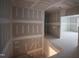 Unfinished hallway with open floor plan to the living room at 6805 Greystone Dr, Raleigh, NC 27615