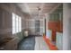 Unfinished kitchen featuring cabinet frames, new black tile floor, and a bright window providing natural light at 6805 Greystone Dr, Raleigh, NC 27615