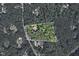 A sprawling property is surrounded by lush forest, providing ultimate privacy at 811 Oxbow Crossing Rd, Chapel Hill, NC 27516