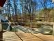 Exterior back yard view from deck features mature landscaping and plenty of privacy at 811 Oxbow Crossing Rd, Chapel Hill, NC 27516