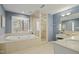 Modern bathroom highlighting a large soaking tub, glass shower, and vanity at 811 Oxbow Crossing Rd, Chapel Hill, NC 27516
