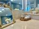 Vanity boasts marble countertops with a decorative mirror and stylish accessories at 811 Oxbow Crossing Rd, Chapel Hill, NC 27516