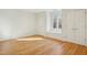 Bedroom featuring hardwood floors, a window seat, and closet doors at 811 Oxbow Crossing Rd, Chapel Hill, NC 27516