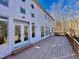 Spacious back deck, perfect for entertaining, with multiple doors leading into the house, offering seamless indoor-outdoor living at 811 Oxbow Crossing Rd, Chapel Hill, NC 27516