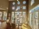 Inviting dining room with many windows, natural light, and access to outdoor deck at 811 Oxbow Crossing Rd, Chapel Hill, NC 27516