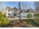 Beautiful two-story home with white exterior and ample parking in the driveway at 811 Oxbow Crossing Rd, Chapel Hill, NC 27516