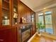 Close-up on the fireplace with built-in cabinets on both sides at 811 Oxbow Crossing Rd, Chapel Hill, NC 27516