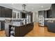 Stylish kitchen with black cabinetry, granite counters, and stainless steel appliances at 811 Oxbow Crossing Rd, Chapel Hill, NC 27516
