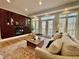 Sun-drenched living room showcases fireplace, built-in shelving, and backyard view at 811 Oxbow Crossing Rd, Chapel Hill, NC 27516