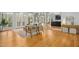Open-concept living area featuring hardwood floors and views into the kitchen at 811 Oxbow Crossing Rd, Chapel Hill, NC 27516