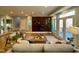 Bright living room boasts a fireplace, built-in shelving, and sliding glass doors to the outdoors at 811 Oxbow Crossing Rd, Chapel Hill, NC 27516
