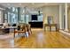 Open-concept living area with views into the kitchen and dining space, featuring hardwood floors at 811 Oxbow Crossing Rd, Chapel Hill, NC 27516