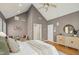 Bright bedroom with a high ceiling and decoratively furnished sitting area at 811 Oxbow Crossing Rd, Chapel Hill, NC 27516