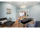 Bright office with a modern chandelier, comfortable lounge chair and open doorway at 811 Oxbow Crossing Rd, Chapel Hill, NC 27516