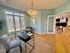Well-lit home office with a modern desk and comfortable chair is seen through a doorway at 811 Oxbow Crossing Rd, Chapel Hill, NC 27516