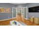 Spacious playroom features hardwood floors and an open doorway leading to another living space at 811 Oxbow Crossing Rd, Chapel Hill, NC 27516