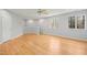 Bright, open room with hardwood floors, recessed lighting, and large windows showcasing the outdoor views at 811 Oxbow Crossing Rd, Chapel Hill, NC 27516
