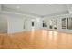 Expansive room with hardwood floors, recessed lighting, and French doors leading to the outdoors at 811 Oxbow Crossing Rd, Chapel Hill, NC 27516