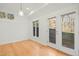 Bright room featuring hardwood floors, recessed lighting, and access to the backyard through glass doors at 811 Oxbow Crossing Rd, Chapel Hill, NC 27516