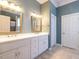 Elegant bathroom with double vanity and gold fixtures at 8620 Humie Olive Rd, Apex, NC 27502