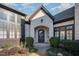 Elegant entryway with a double door and brick facade at 1319 Queensferry Rd, Cary, NC 27511