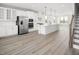 Modern kitchen featuring white cabinets, stainless steel appliances, and an island at 1368 Chowan Ave, Durham, NC 27713