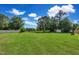 Spacious backyard with large trees and shed at 151 Crosscreek Ln, Angier, NC 27501