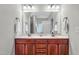 Double vanity bathroom with a large mirror and updated fixtures at 151 Crosscreek Ln, Angier, NC 27501