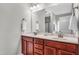 Double vanity bathroom with a large mirror and updated fixtures at 151 Crosscreek Ln, Angier, NC 27501