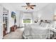 Spacious primary bedroom with a ceiling fan and large window at 151 Crosscreek Ln, Angier, NC 27501
