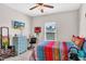 Bright bedroom with window, dresser, and colorful bedding at 151 Crosscreek Ln, Angier, NC 27501