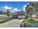 House with a two-car garage and landscaped yard at 151 Crosscreek Ln, Angier, NC 27501