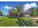 Brick house with a tree, lawn, and driveway at 151 Crosscreek Ln, Angier, NC 27501
