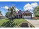 Two-story house with front yard and driveway at 151 Crosscreek Ln, Angier, NC 27501