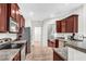 Bright kitchen featuring stainless steel appliances and rich wood cabinets at 151 Crosscreek Ln, Angier, NC 27501