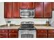 Kitchen with stainless steel appliances and wood cabinets at 151 Crosscreek Ln, Angier, NC 27501