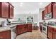 Spacious kitchen with stainless steel appliances and wood cabinets at 151 Crosscreek Ln, Angier, NC 27501