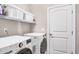 Laundry room with washer, dryer, and shelving at 151 Crosscreek Ln, Angier, NC 27501