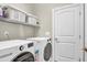 Laundry room with washer, dryer, and shelving at 151 Crosscreek Ln, Angier, NC 27501