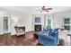 Living room with fireplace, hardwood floors, and backyard access at 151 Crosscreek Ln, Angier, NC 27501